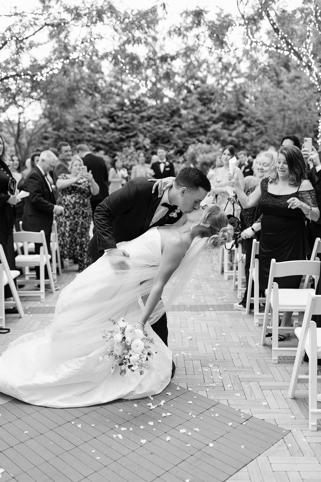 Wedding planner managing ceremony while couple celebrates in New Jersey