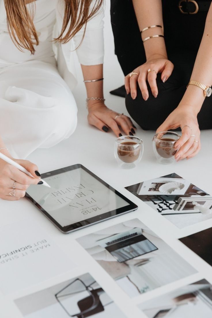 Wedding planner reviewing budget spreadsheet with couple in New Jersey planning session