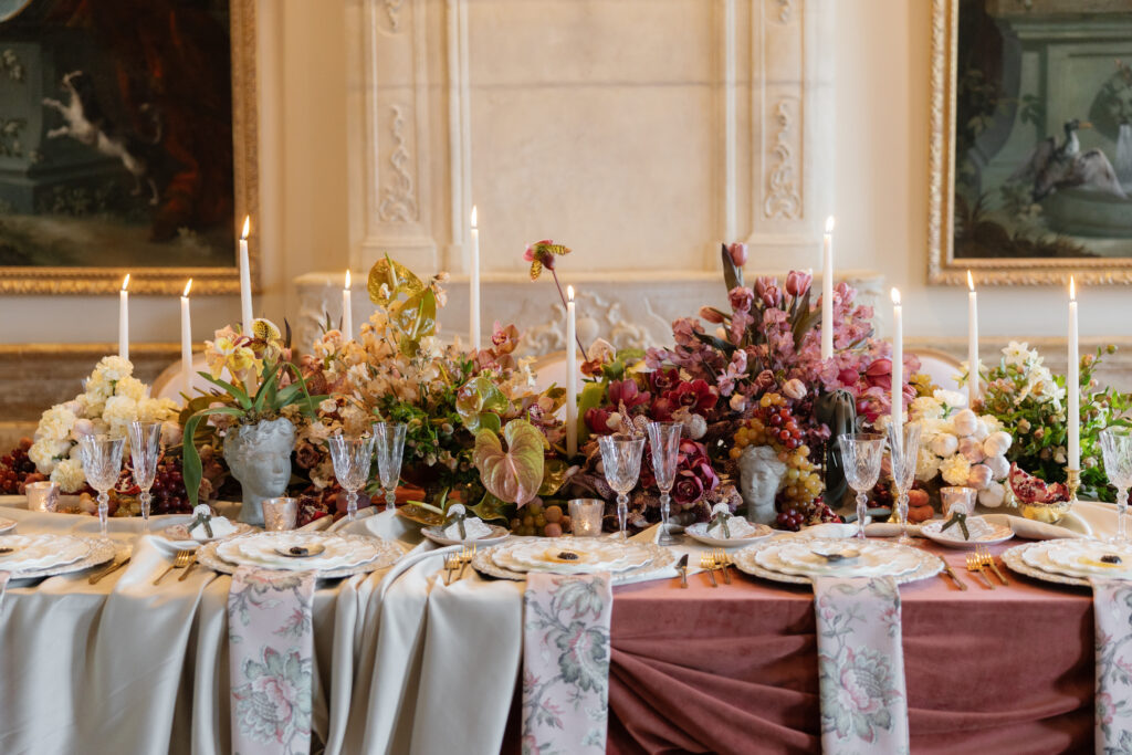 Elegant New Jersey wedding reception table design featuring layered florals, taper candles, and refined place settings, showcasing seamless New Jersey wedding planning and structured event flow.