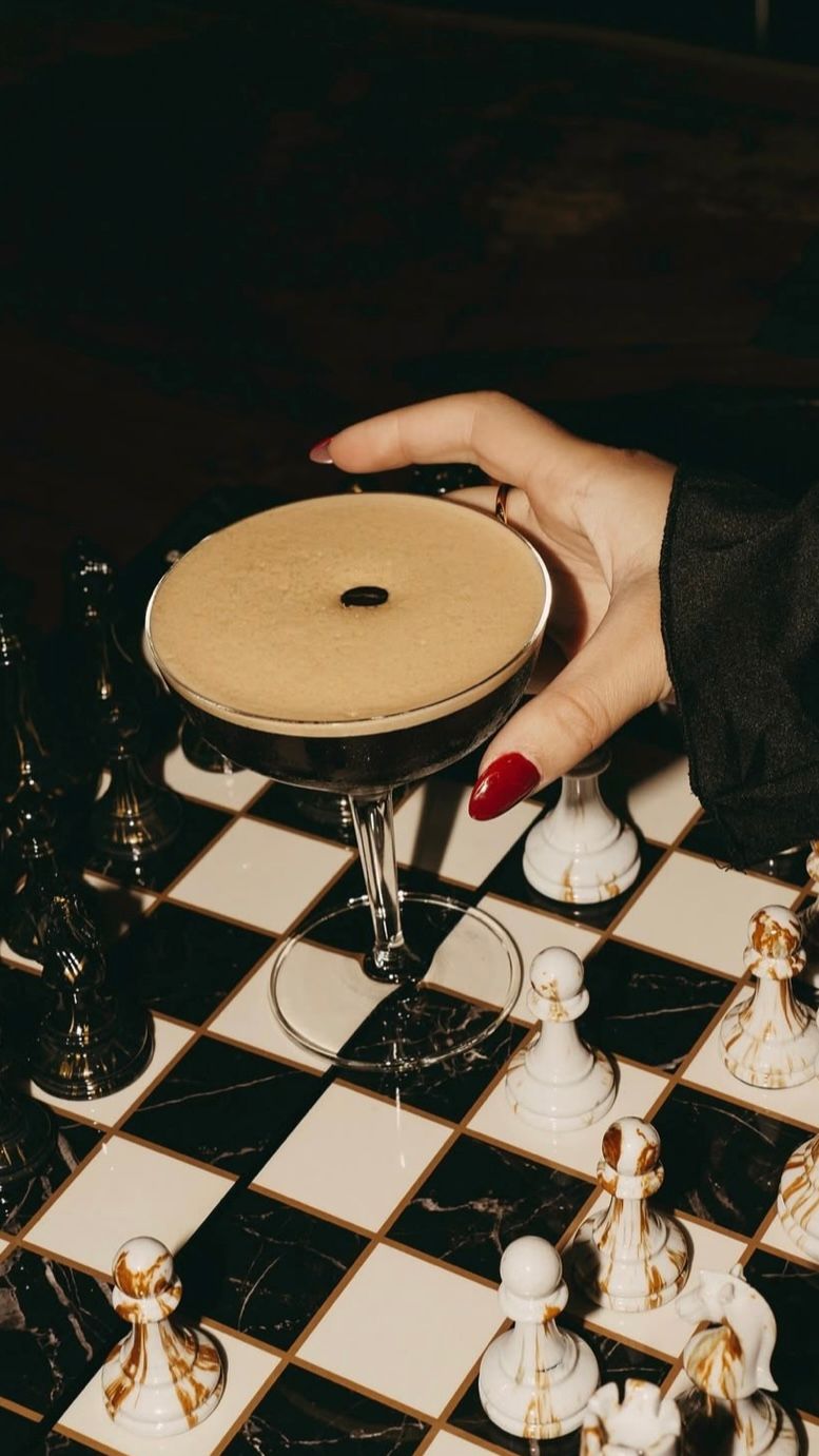 espresso martini on chessboard detail at New York City wedding planned when couples plan wedding yourself NYC