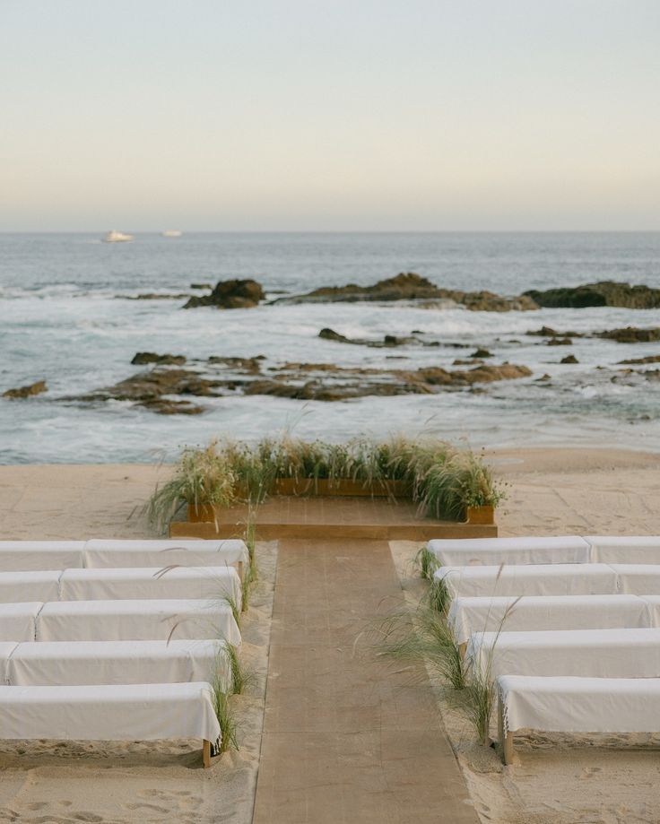 beach wedding ceremony setup Wilmington NC with aisle seating and ocean view planned by outdoor wedding planner Wilmington NC