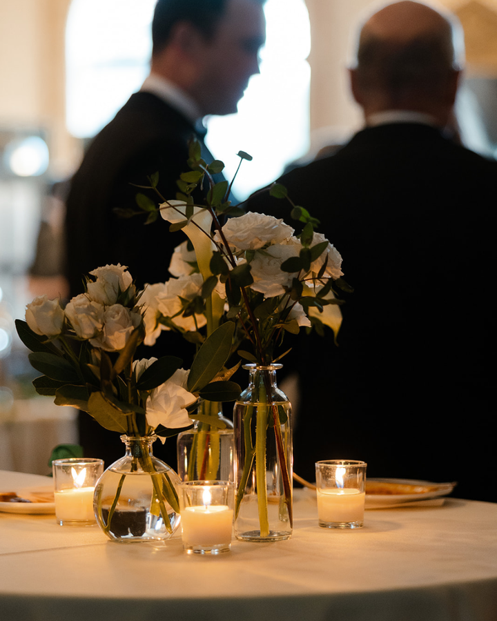 Elegant New Jersey ballroom wedding reception with candlelit tables and floral centerpieces