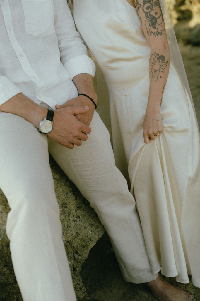Bride and groom exchanging rings during an intimate outdoor wedding ceremony with their officiant.